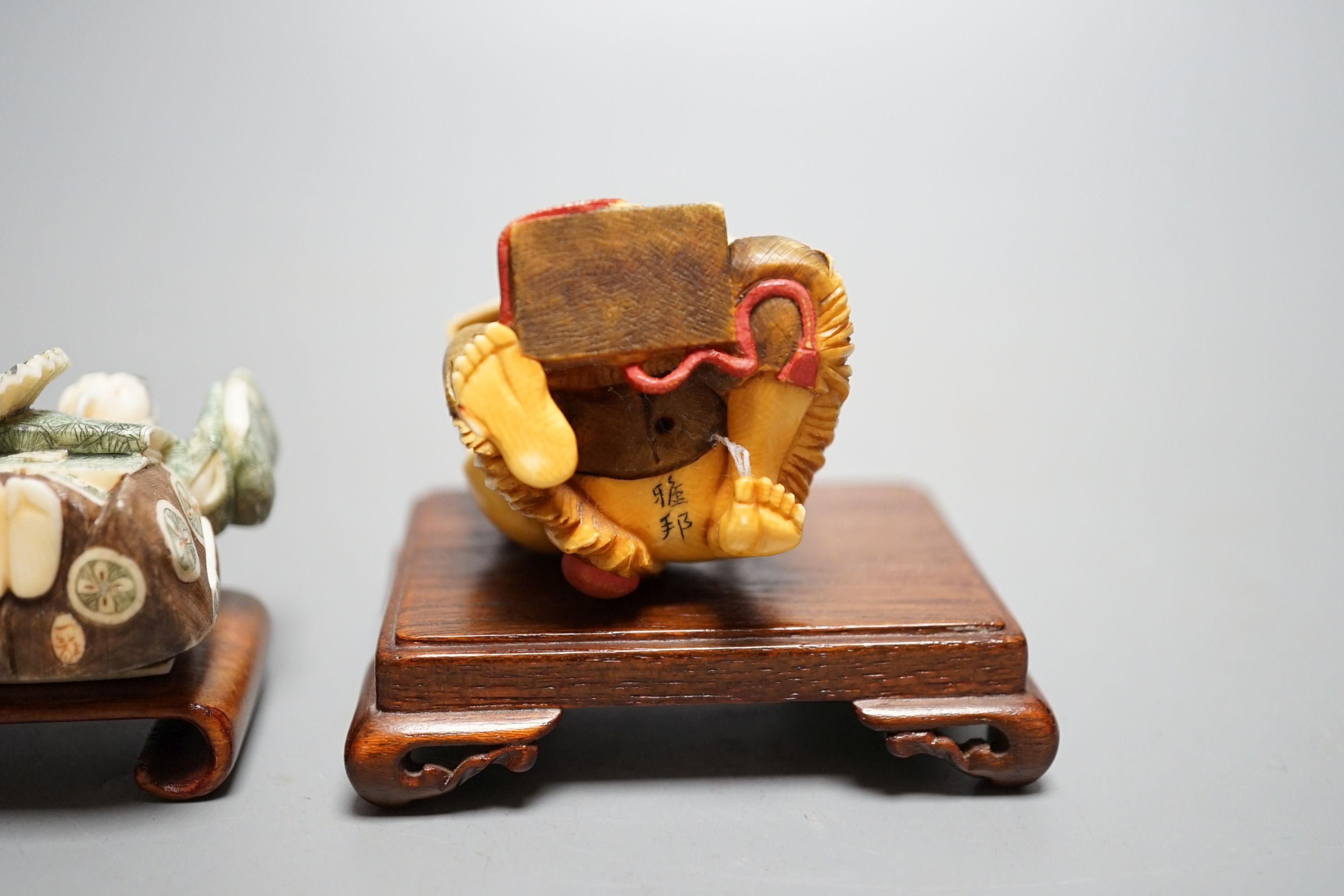 Two Japanese stained ivory okimono-netsuke of a priest and a man with a box, Taisho/early Showa period, signed - 6cm tall